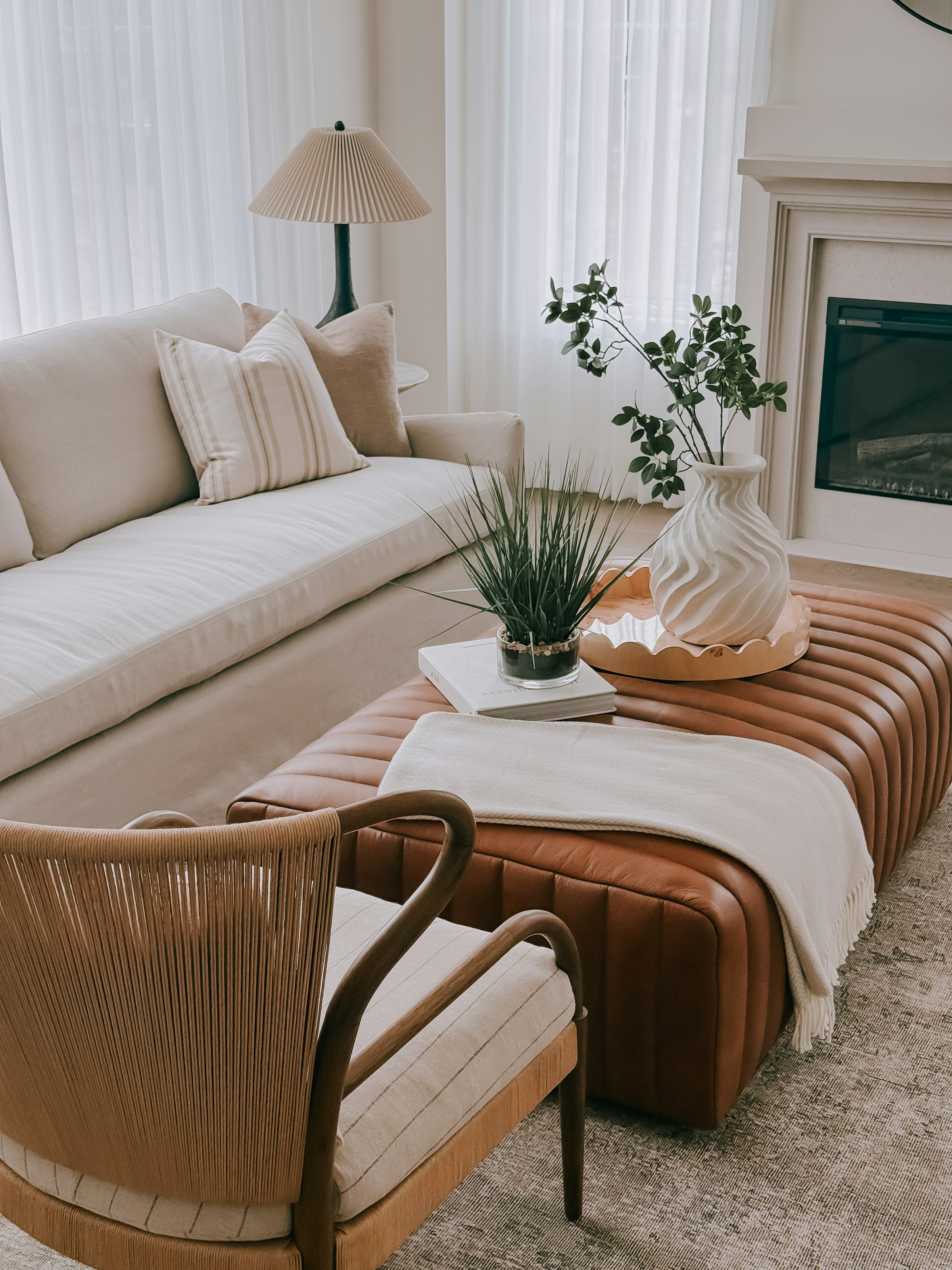 Family room with generous sectional, rounded forms, and storage