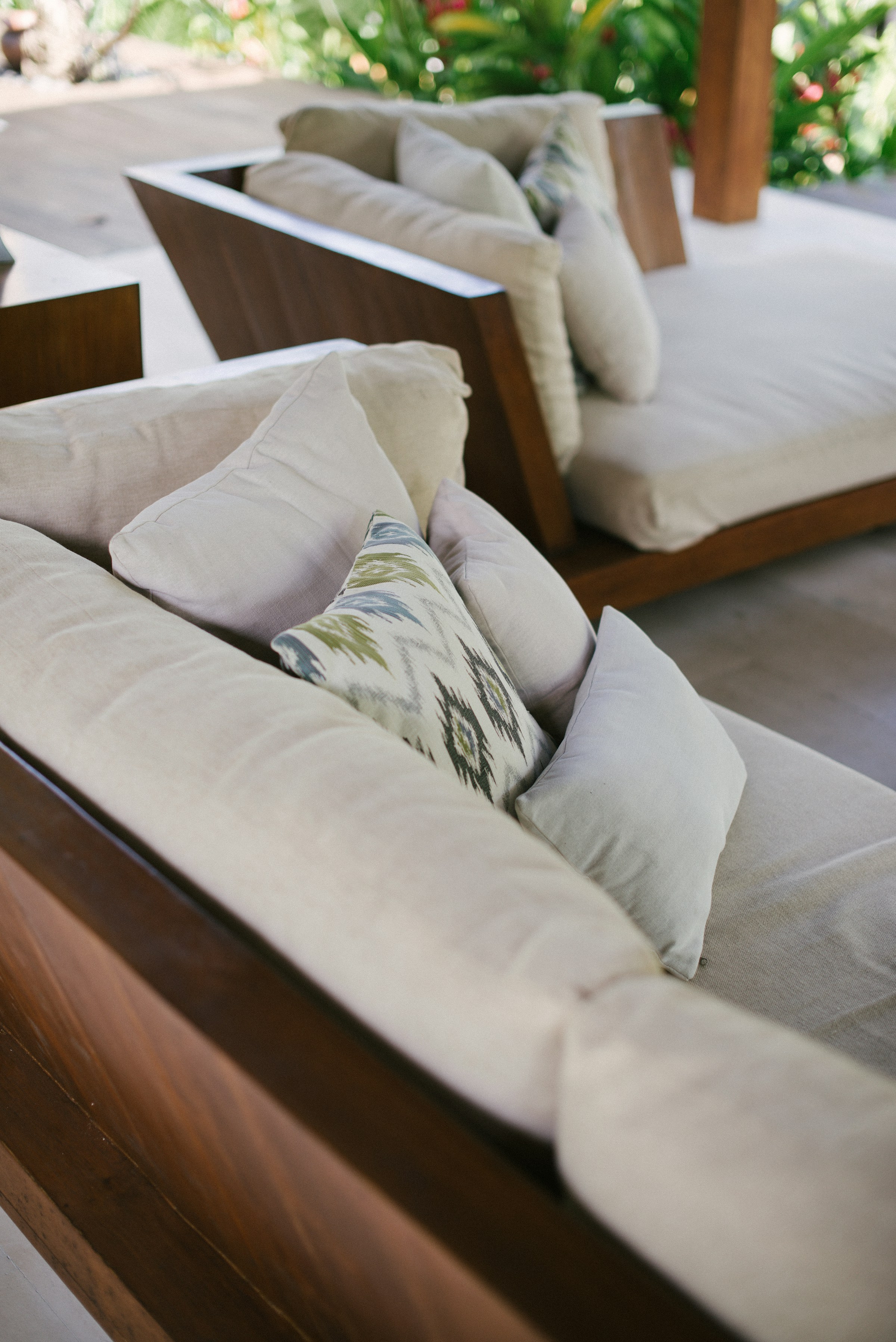 Detail: outdoor cushions, teak or aluminum frame, and a planter